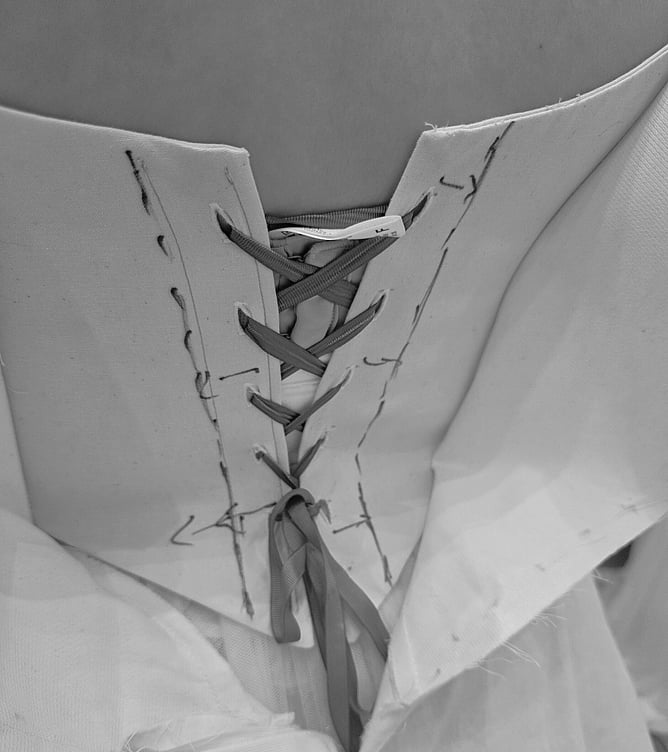 Bride attending bespoke wedding dress fitting