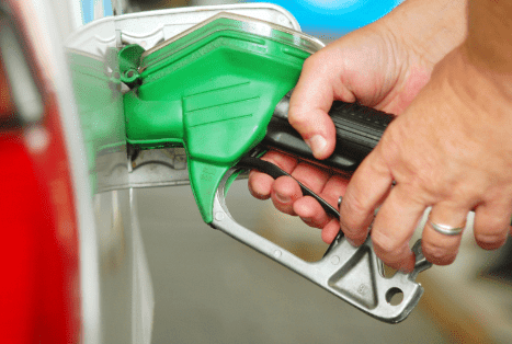 pumping petrol into a car