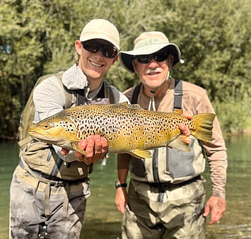 Ollie Bassett Fly Fishing guiding client with trophy brown trout