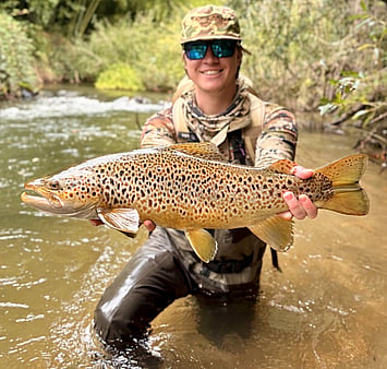 Happy guiding client with Rotorua brown trout Ollie Bassett Fly Fishing Guiding
