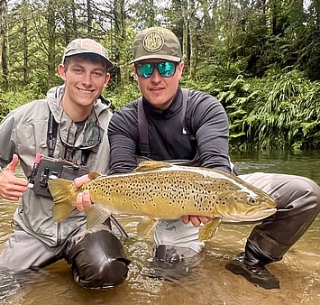 Ollie with happy client and Rotorua brown trout