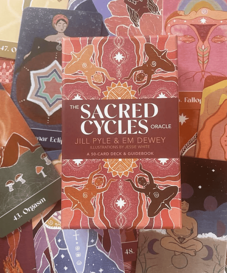 the sacred cycles oracle deck by Jill Pyle and EM Dewey pictured on the cards from the deck