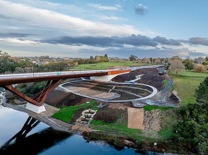 Trailer mounted Crewmix volumetric concrete plant positioned to pour concrete on bridge underpass
