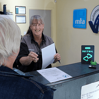 Automotive Solutions Kauri receptionist greeting a customer