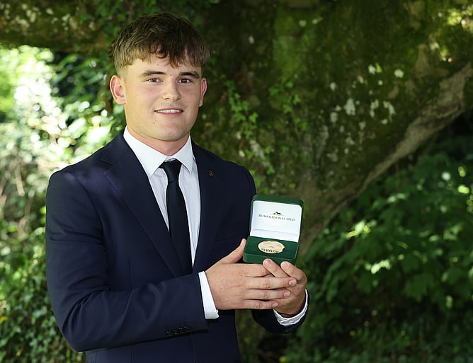 Joe Moore pictured after being awarded a Gold medal for top-performing student.