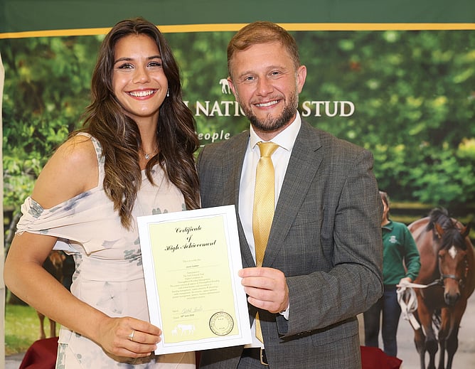 Zania Slabber pictured receiving her certifacte of High Achievement.