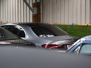 Silver Mercedes Benz stored among other cars at PB Group