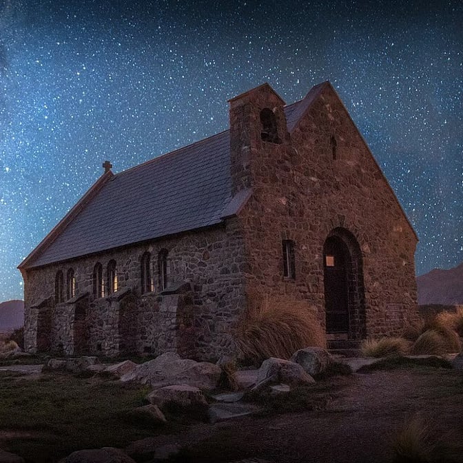 Church of the Good Shepherd under a starlit night sky at Lake Tekapo, New Zealand
