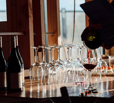 Wine being poured at an Ebode mid-build open home event