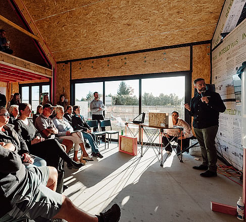 Guests seated inside an Ebode home during a mid-build open home presentation
