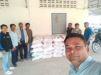 Cambodian Pastors receiving gifts of rice