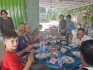 Mission team eating in Cambodia