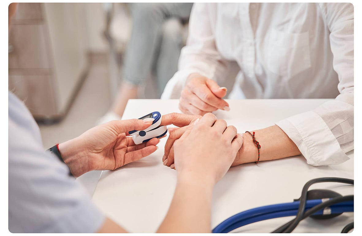 Healthcare worker checking a patient's blood pressure