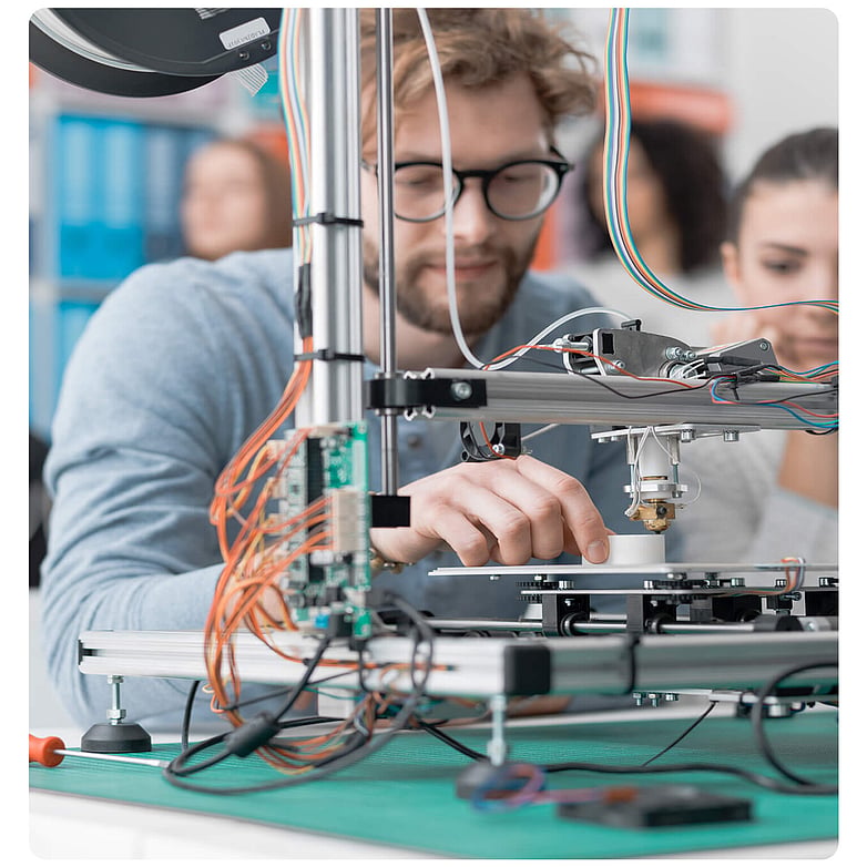 Technician working on electronic components in a laboratory