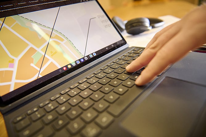 Person using a laptop for strategic planning, project management and business planning.
