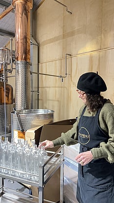 Hand bottling small-batch craft gin in New Zealand