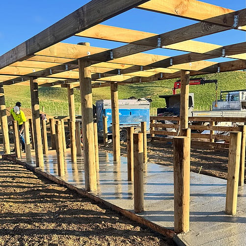 Concrete pad for farm shed poured by Crewmix CM1000 machine
