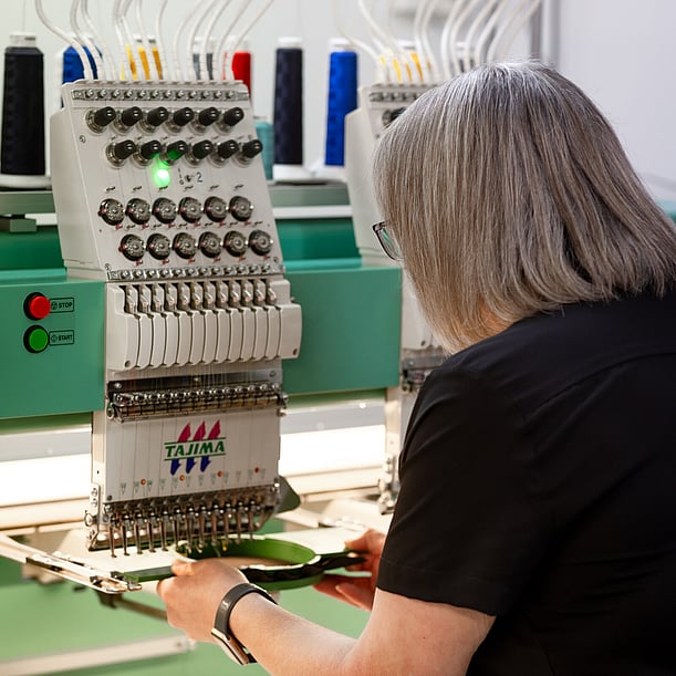 Custom Branded Clothing being embroidered