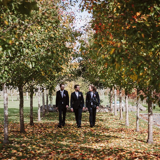 Groom and Groomsman in Autumn-looking Trees
