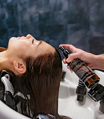 Premium hair health treatment and scalp ritual being applied