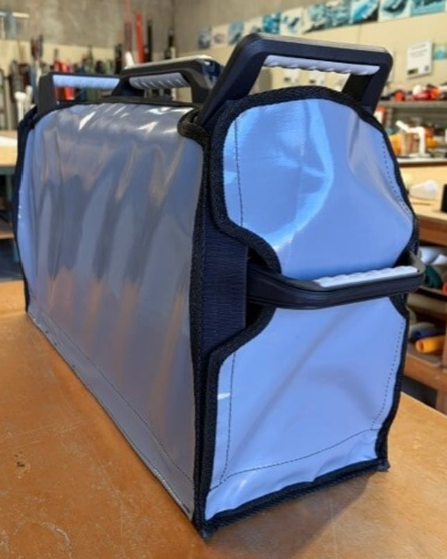 Custom PVC welder cover with shaped cut-out for controls and handle clearance ·Popup caption: The panel is shaped around the welder's controls and handles for a precise, tight fit.