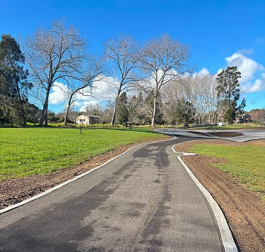 Driveway laid with Vernon Developments recycled asphalt and concrete curb
