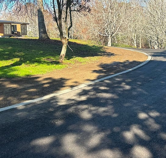 Driveway laid with Vernon Developments recycled asphalt and concrete curb