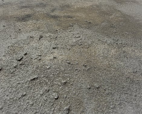 detail image showing irregular clusters of pumice texture, subtle raised surface, softly blended mineral and stone tones, smooth recessed areas and densely textured patches