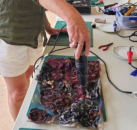 Person creating art from mixed paper. Alysn Midgelow-Marsden workshop for Waimarino Art Awards 2026