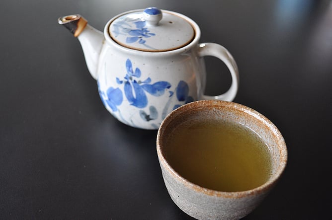 A Japanese teapot and cup of green tea