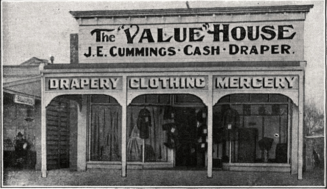 Historical black-and-white photograph of The Value House storefront belonging to J.E. Cummings.