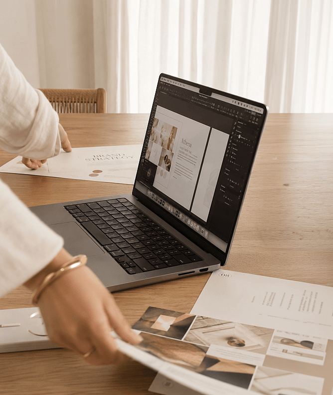 Designer developing a strategic website layout and brand identity to align with business goals and customer needs.