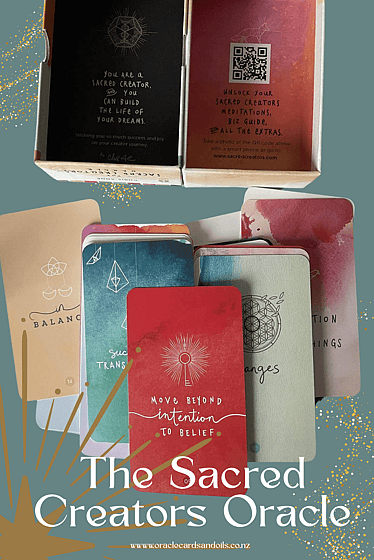 the sacred creators oracle deck by chris-anne the box and a display of some of the cards