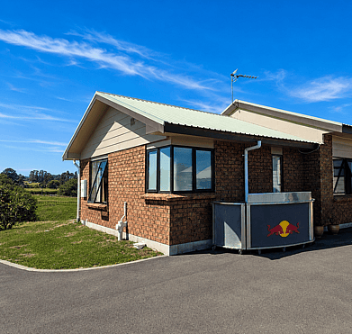 Before exterior repaint  brick and weatherboard house in Rotorua