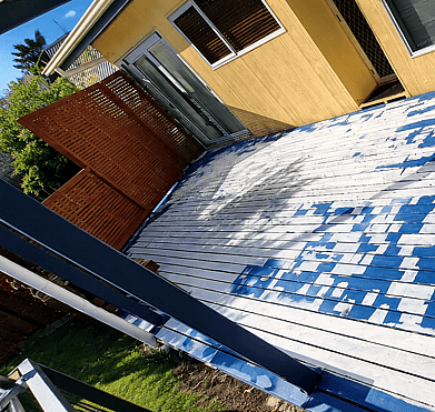 Before deck repaint showing weathered timber surface in Tauranga