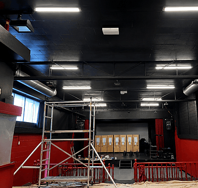 Before exterior repaint of community theatre with burgundy finish in Rotorua