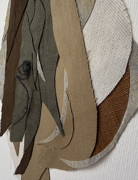 detail image of neutral earth-toned linen and cotton fragments, showing weave texture and soft frayed edges