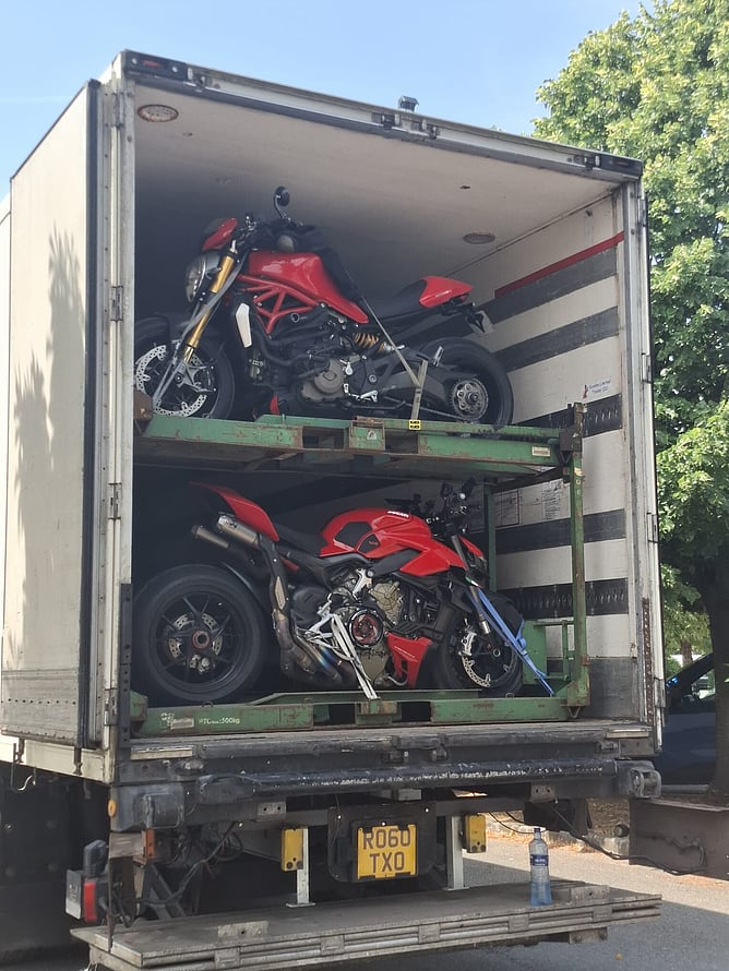 Bikes being loaded onto the truck for the trip back to the UK