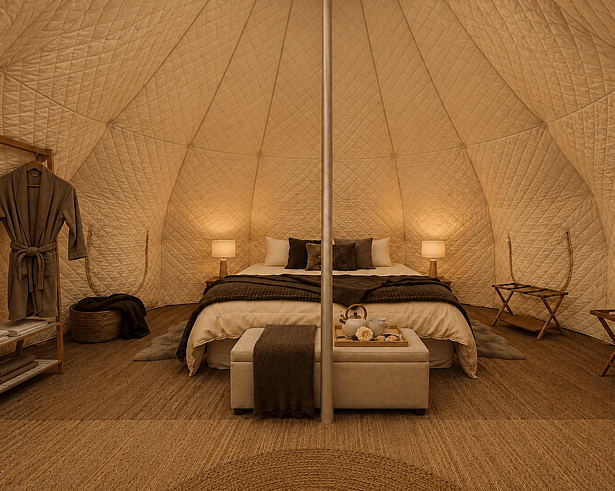     &ldquo;Spacious interior of a Lotus Belle Stargazer tent with luxury bedding and furnishings.&rdquo;