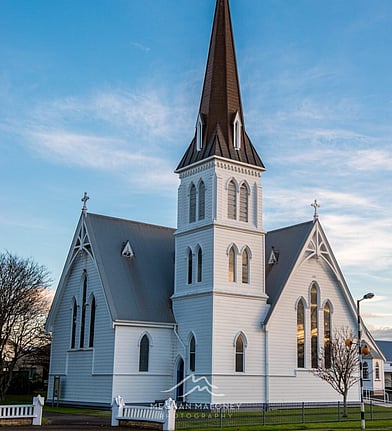 St Andrew's Anglican Church steeple against a blue sky, Cambridge NZ