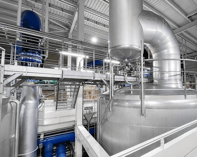 Stainless steel tanks and pipework inside the LESAFFRE industrial wastewater treatment facility