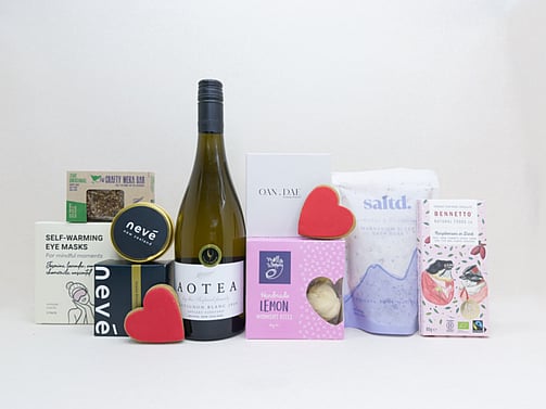 Thinking of You gift box with Aotea wine, Bennetto chocolate, Lemon Moment cookies, Neve candle, Soleiz eye mask, Saltd bath salts, and thoughtful self-care treats, beautifully presented for gifting.