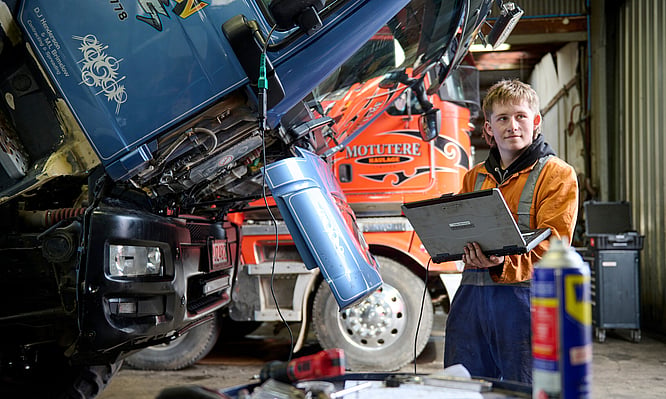 Diesel mechanic checking diagnostics on a fleet truck. Dudley Mechanical & Parts. Taupo.