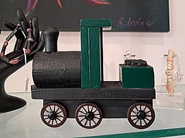 Handcrafted wooden train toy by Philip Steele