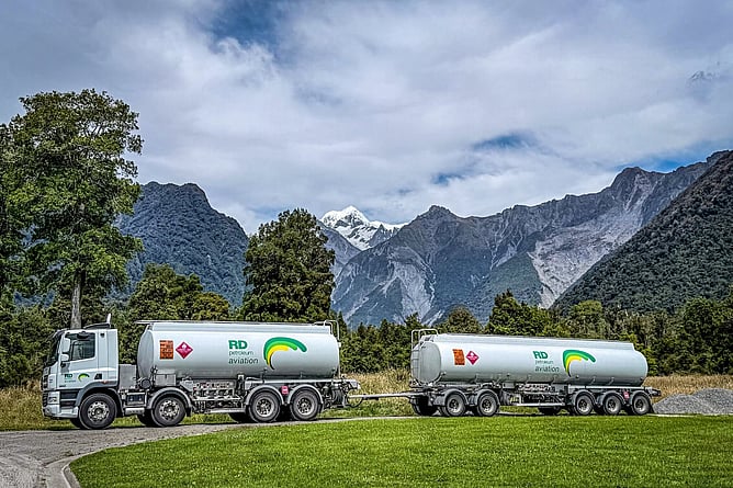 RD Petroleum aviation fuel tankers parked near Fox Glacier with Southern Alps in the background
