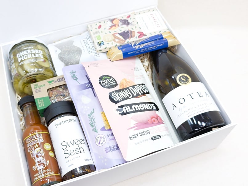 Food and wine hamper featuring gourmet snacks, premium wine and quality New Zealand products.