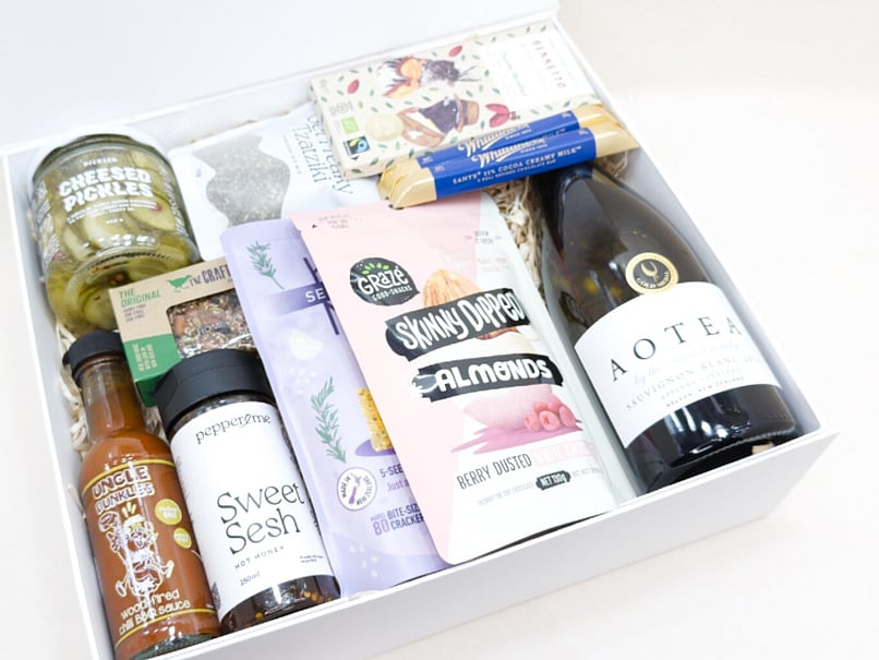 food and wine hamper - aotea sauvignon blanc, sweet sesh, uncle dunkle hot sauce, pickled , benetto chocolate, pepper & me tzakiki dip