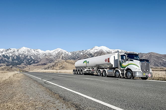 RD Petroleum aviation fuel tanker parked roadside at Castle Hill, Canterbury, snow-capped mountains behind