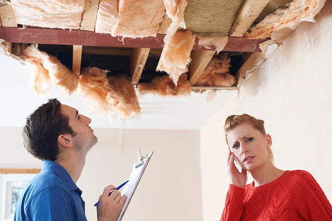 couple dealing with roof needing repair