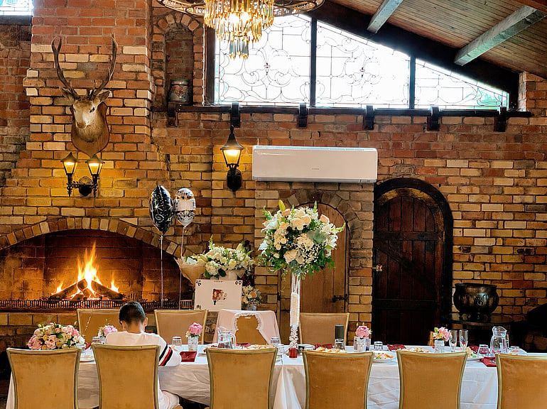 Dining beside the open fireplace at Game Keepers Restaurant